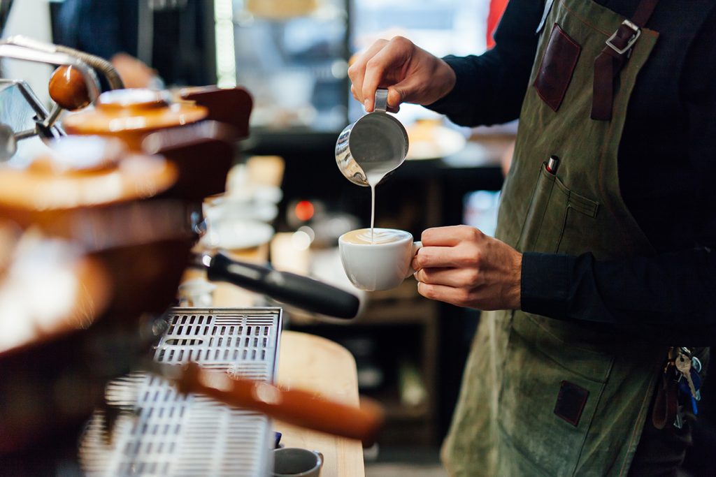 Barista making coffee in coffee shop in Memorial City at CityCentre.