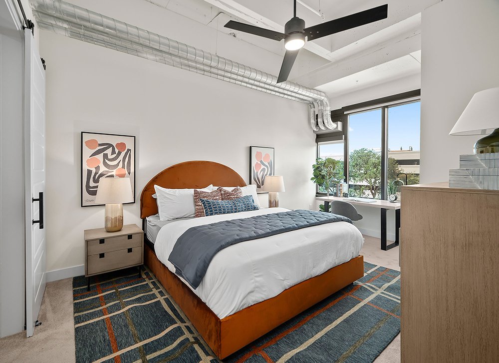 The Watt Apartments bedroom with high ceilings and outside views of Westlake and the Energy Corridor.