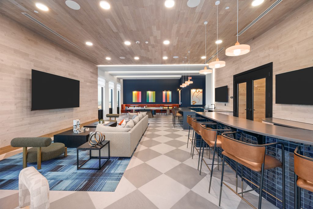 The Watt Rooftop Clubroom with Bar Area, Sofa, TV, and Ping-Pong Table