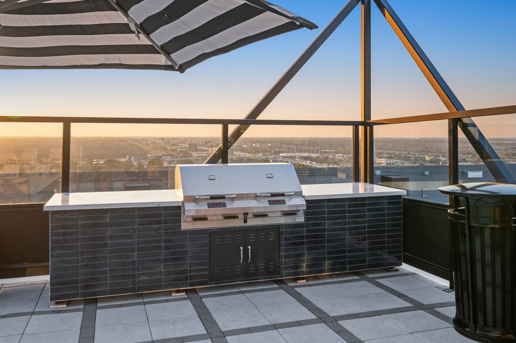 Rooftop skyline lounge grilling station